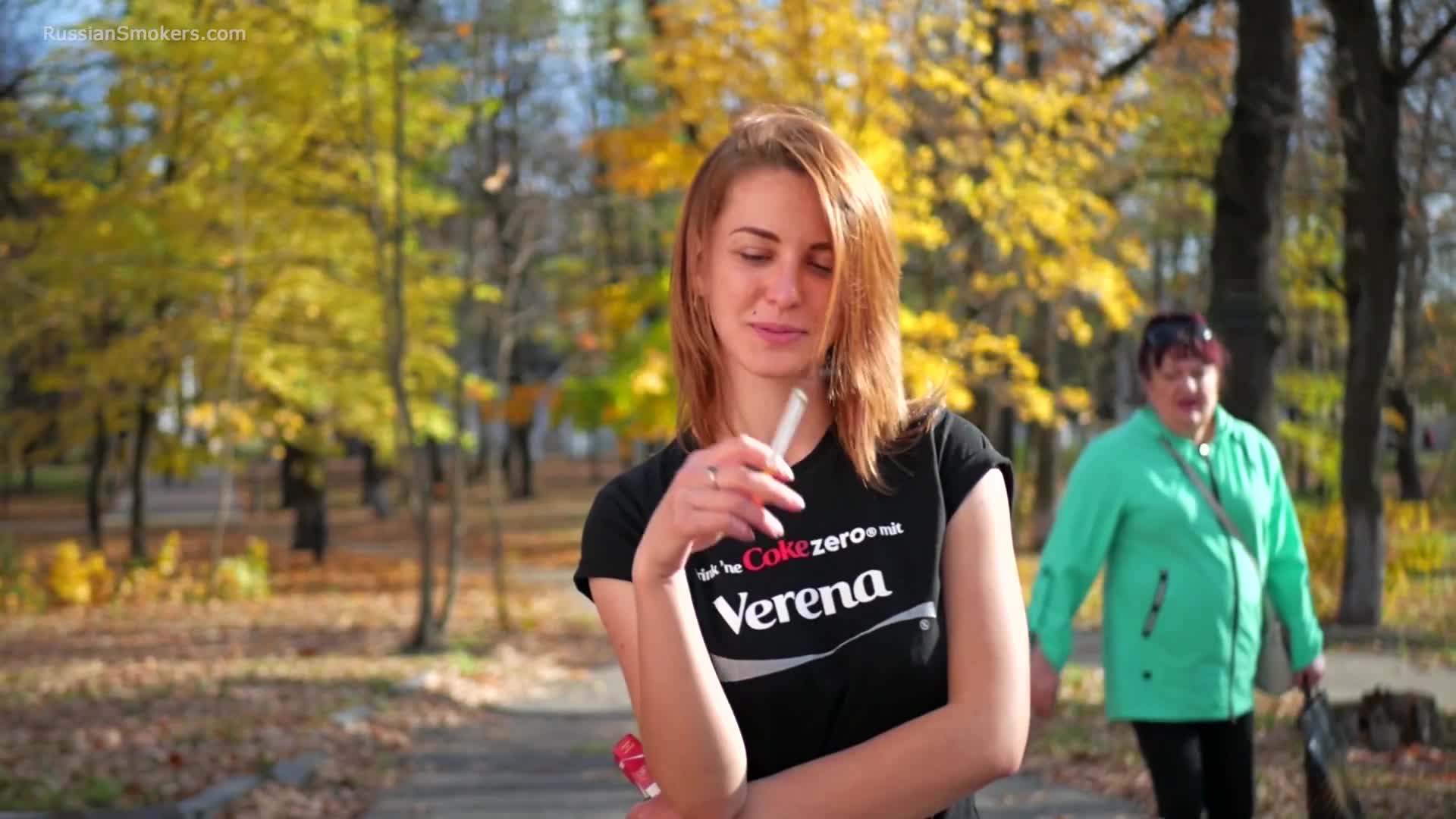 Sasha is smoking two cigarettes in the park RussianSmokers